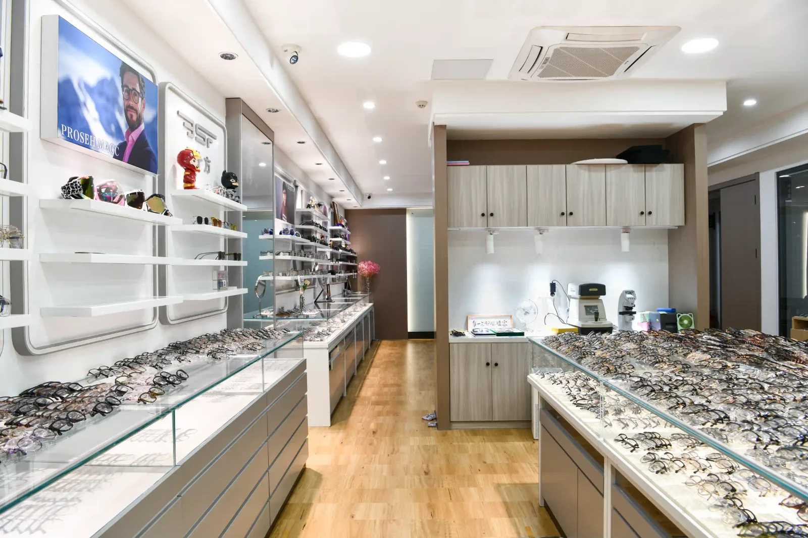 Display cabinets lined with hundreds of eyewear samples in the HAO Eyewear showroom