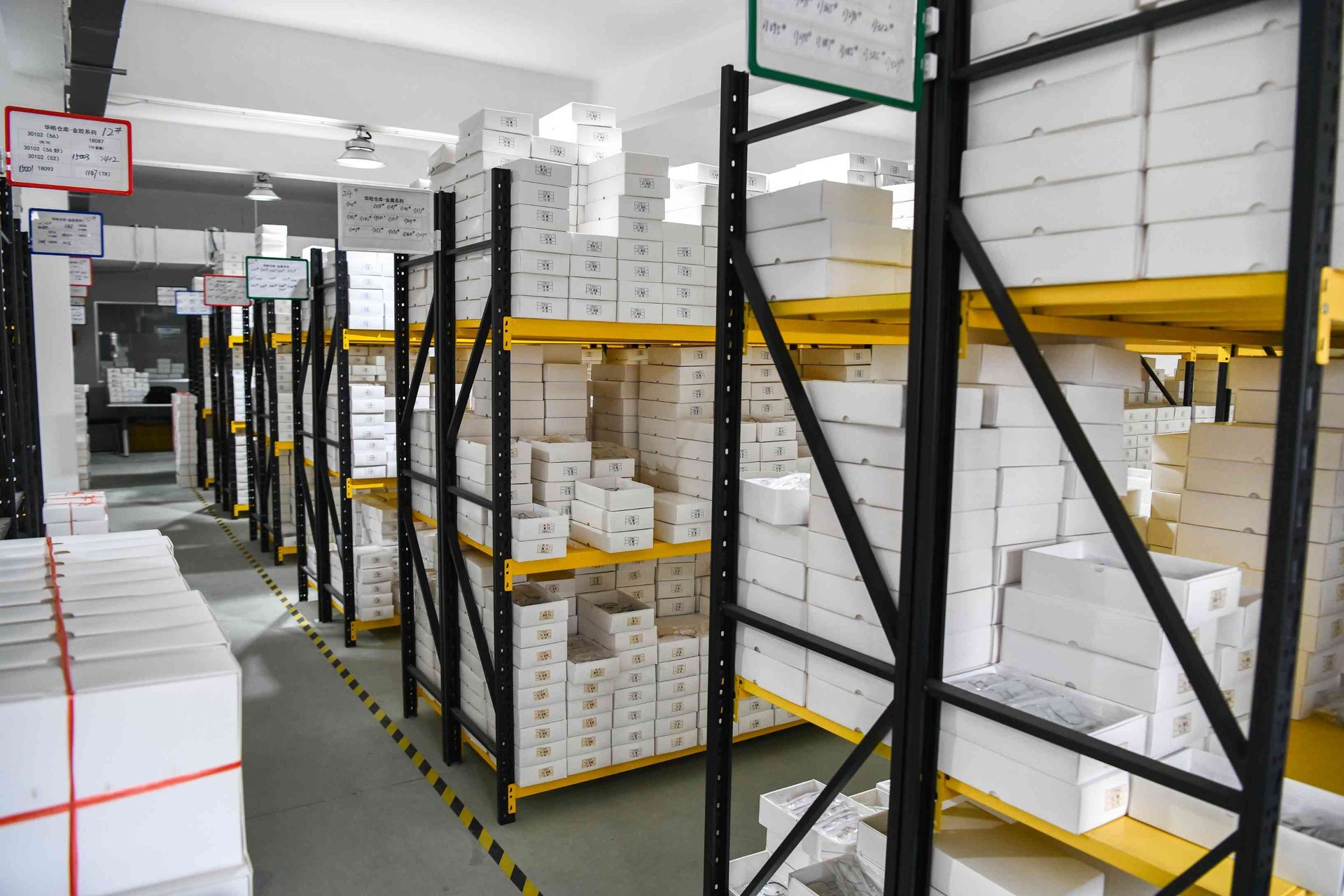 Ready stock eyewear warehouse with over 1 million frames in organized SKU racking at HAO Eyewear in Danyang